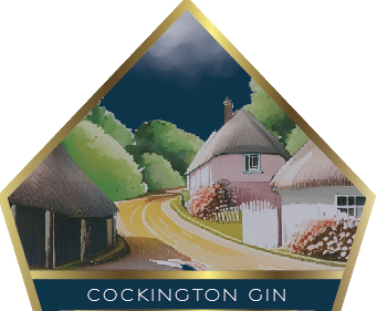 The bottle label featuring a picturesequre view of Cockington Village in Torquay, Devon.